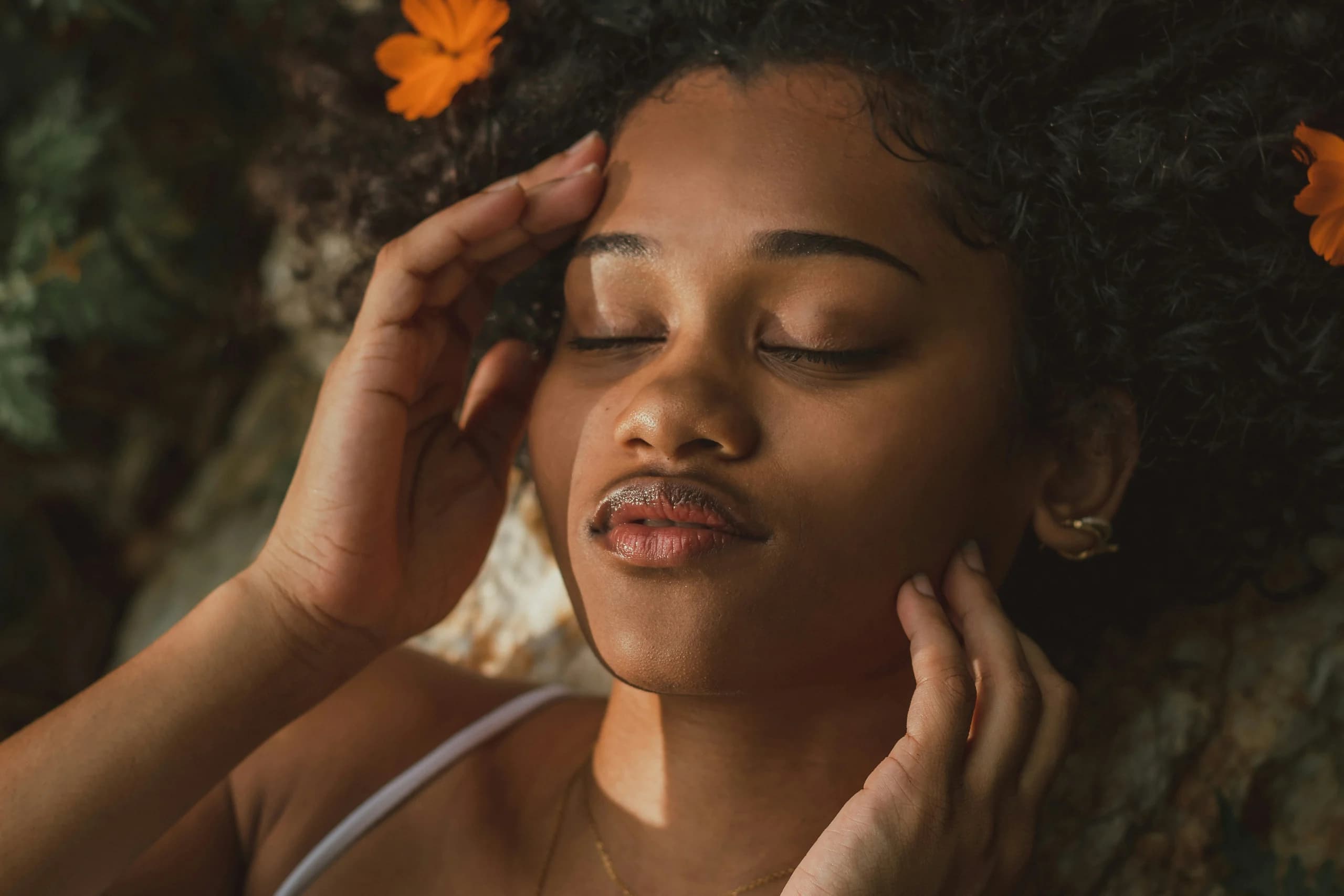 Woman holding her face, checking her skin